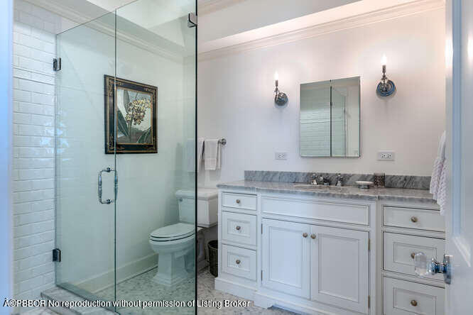 229 Pendleton Avenue Palm Beach, FL 33480 - Photo 29 of 36 a bathroom with a granite countertop toilet sink and mirror
