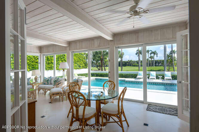 229 Pendleton Avenue Palm Beach, FL 33480 - Photo 10 of 36 a view of a dining room with furniture window and outside view