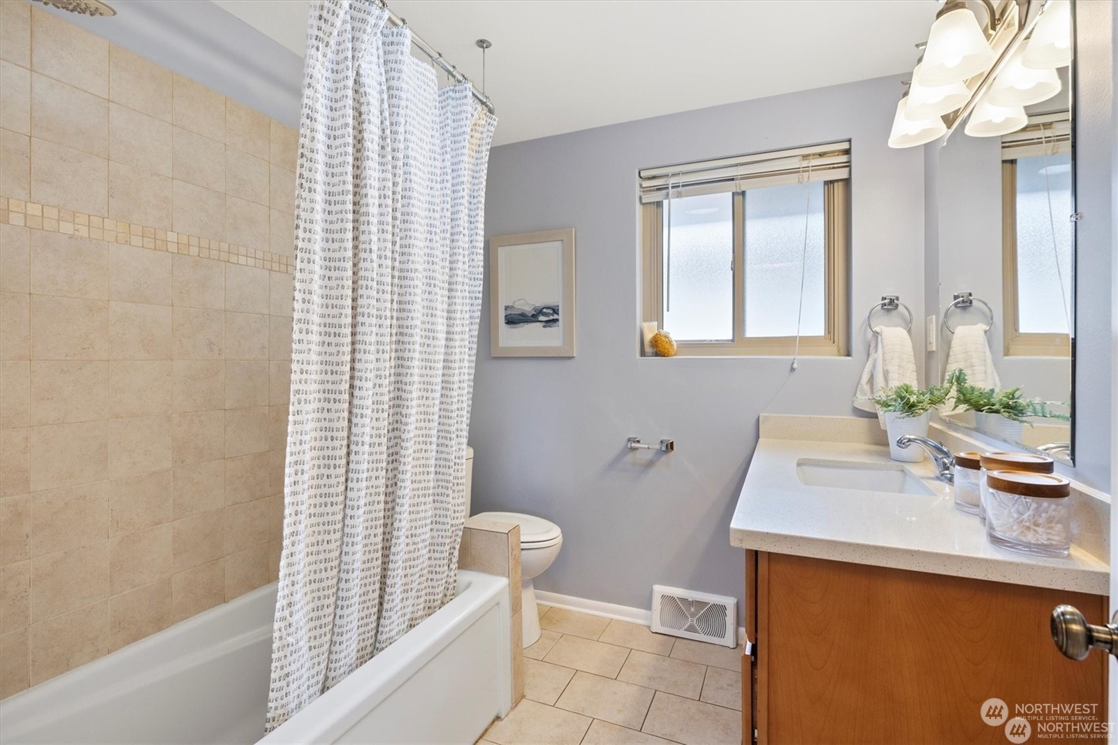 3801 Northeast 75th Street Seattle, WA 98115 - Photo 16 of 40 a bathroom with a sink a toilet and shower