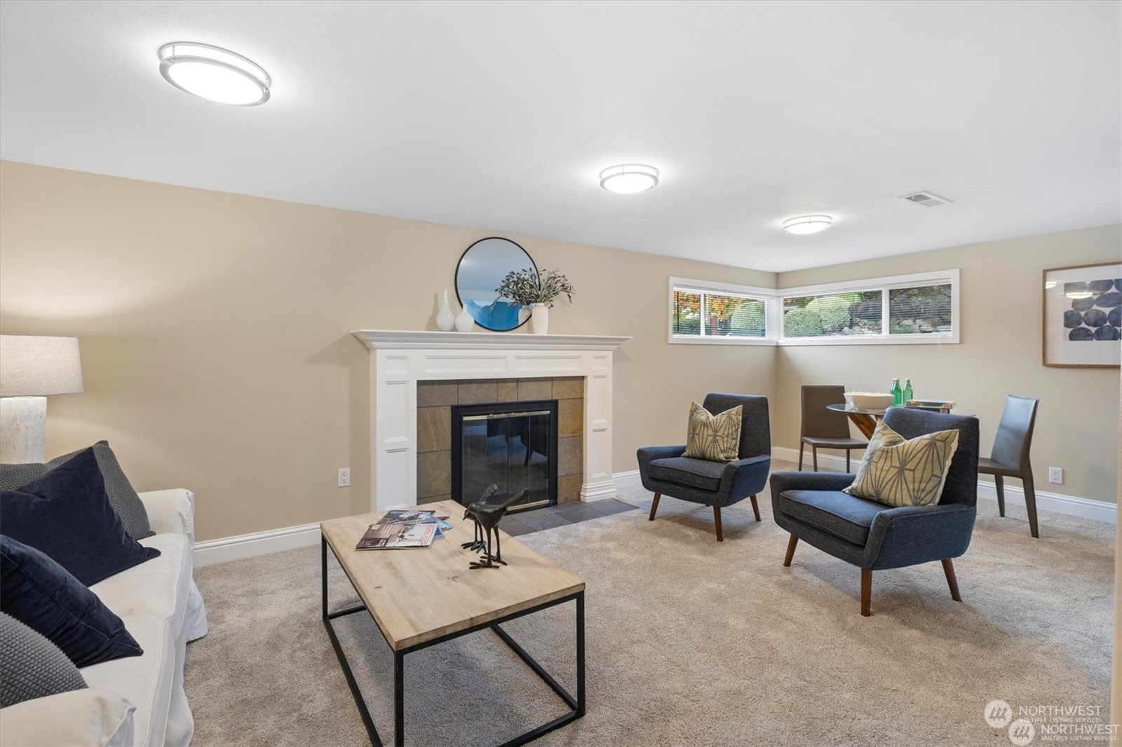 3801 Northeast 75th Street Seattle, WA 98115 - Photo 17 of 40 a living room with furniture and a fireplace