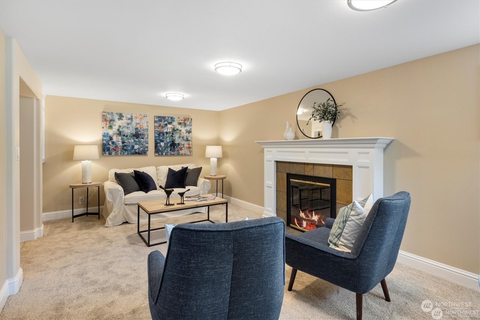 3801 Northeast 75th Street Seattle, WA 98115 - Photo 18 of 40 a living room with furniture and a fireplace