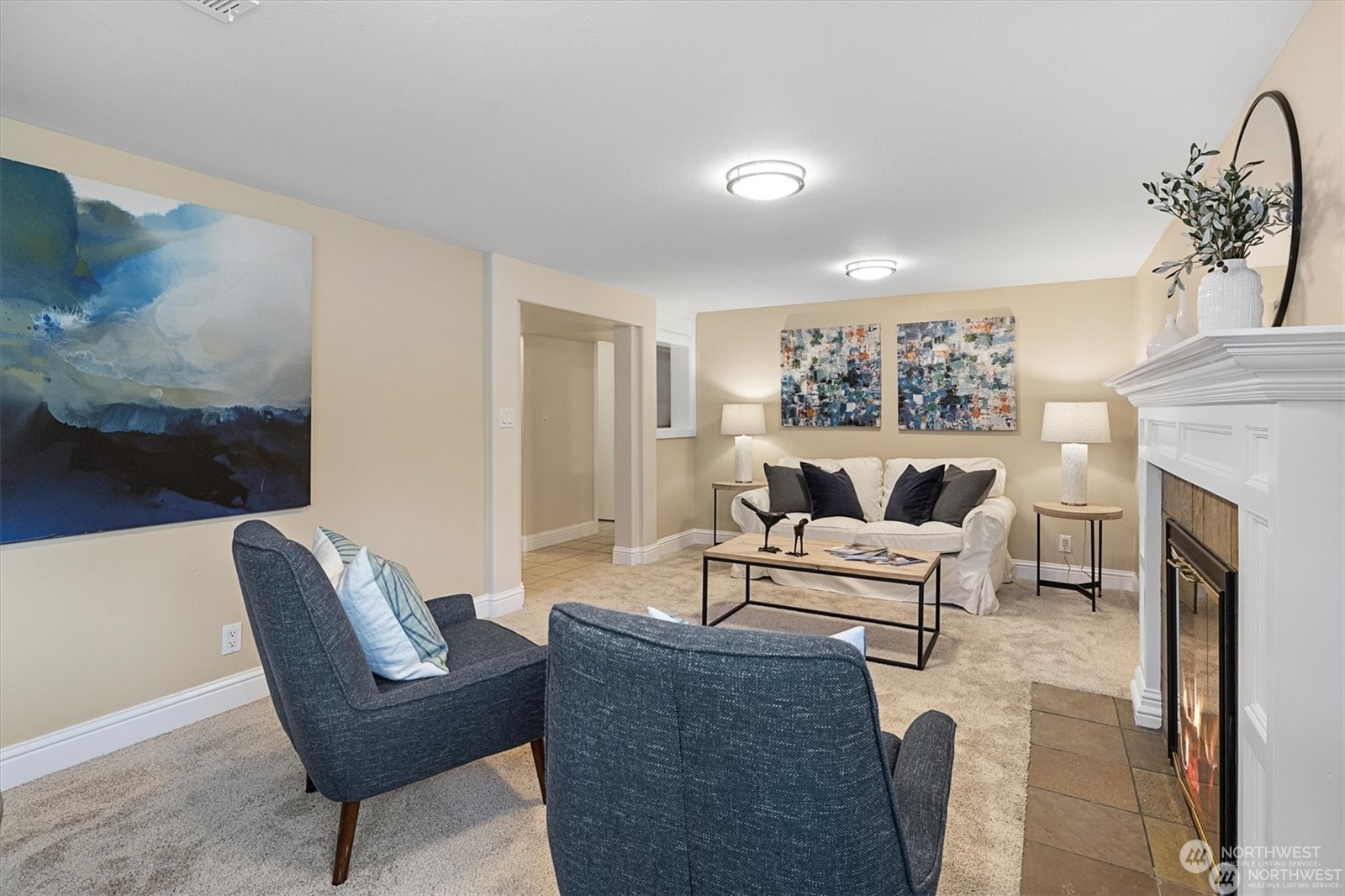 3801 Northeast 75th Street Seattle, WA 98115 - Photo 19 of 40 a living room with furniture and a fireplace