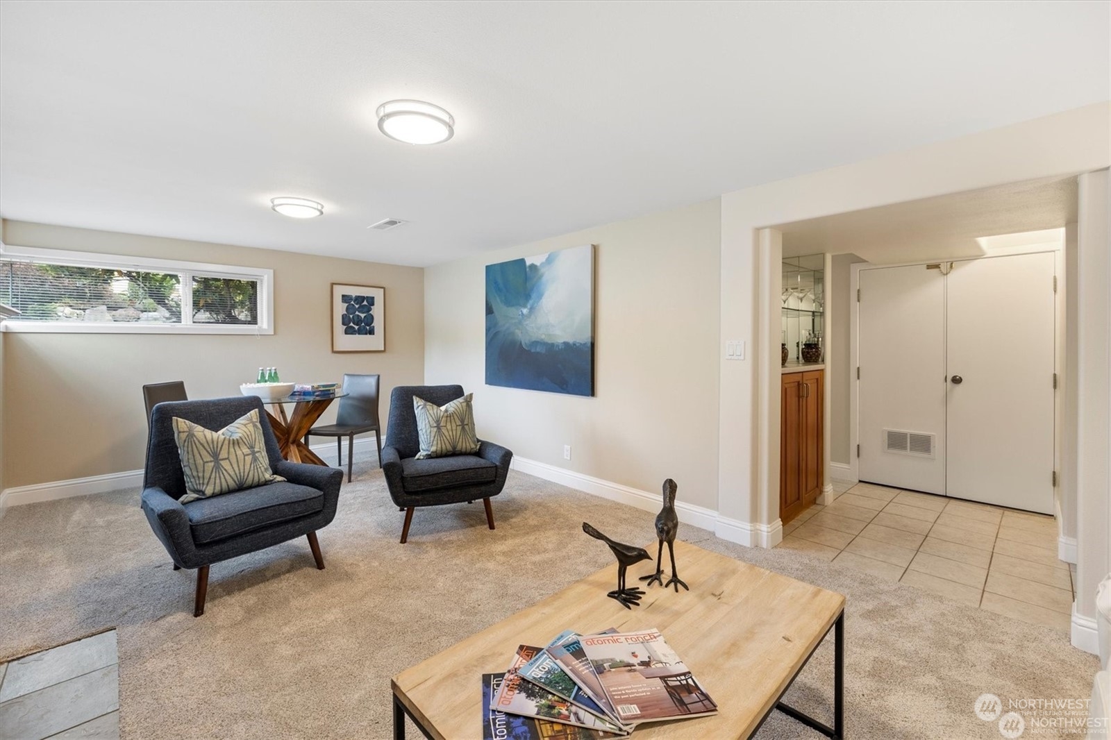 3801 Northeast 75th Street Seattle, WA 98115 - Photo 20 of 40 a living room with furniture and a wooden floor