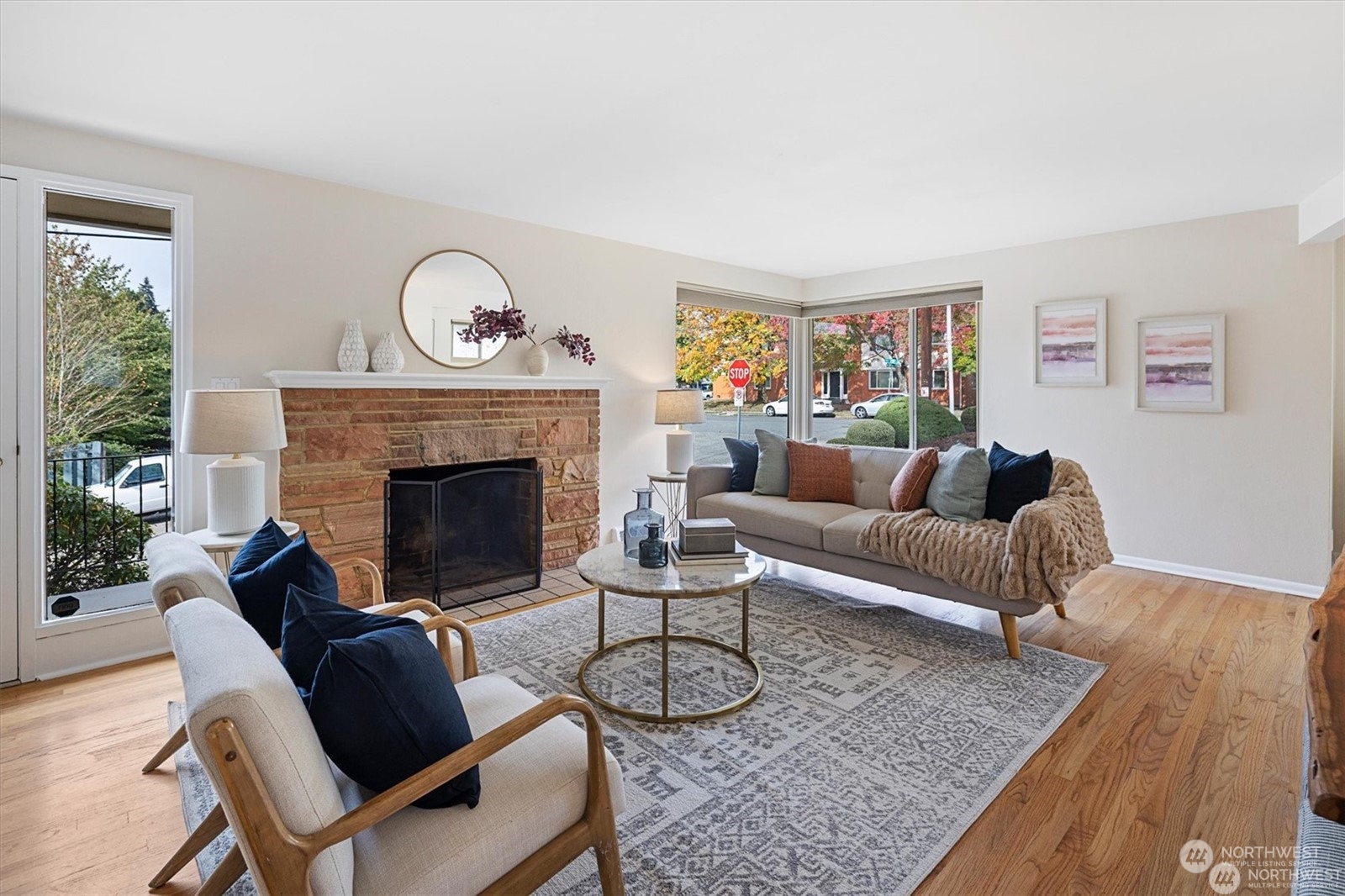 3801 Northeast 75th Street Seattle, WA 98115 - Photo 2 of 40 a living room with furniture a rug and a fireplace