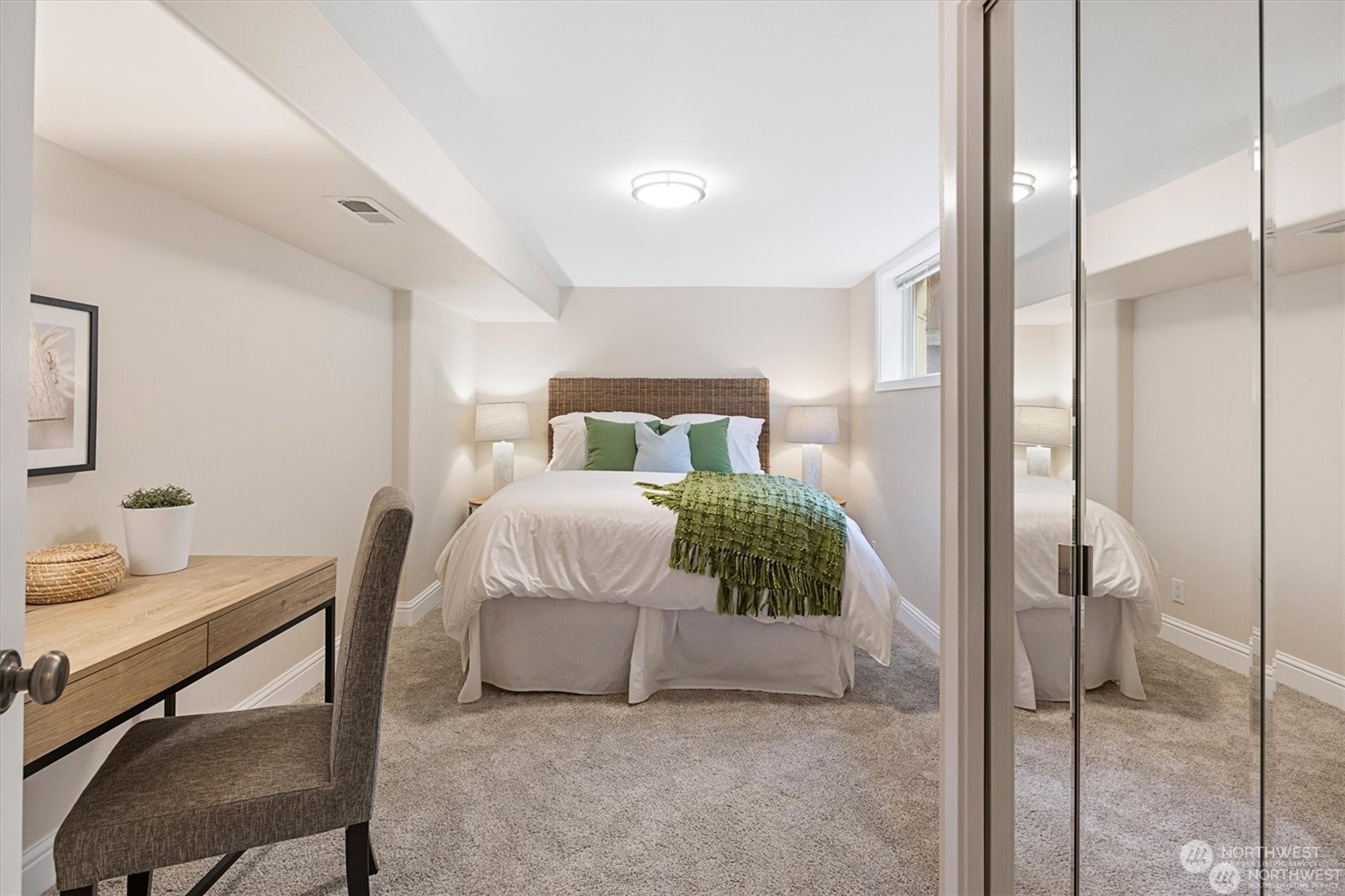 3801 Northeast 75th Street Seattle, WA 98115 - Photo 22 of 40 a bedroom with a bed and a table in it