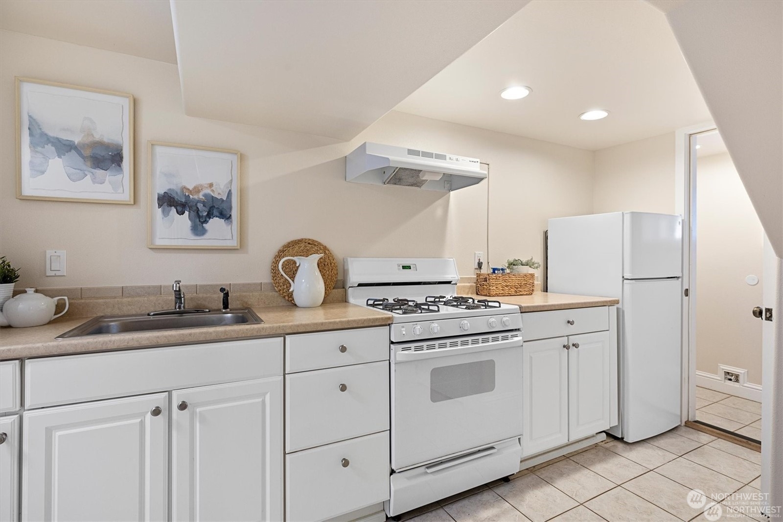 3801 Northeast 75th Street Seattle, WA 98115 - Photo 24 of 40 a kitchen with white cabinets and white appliances