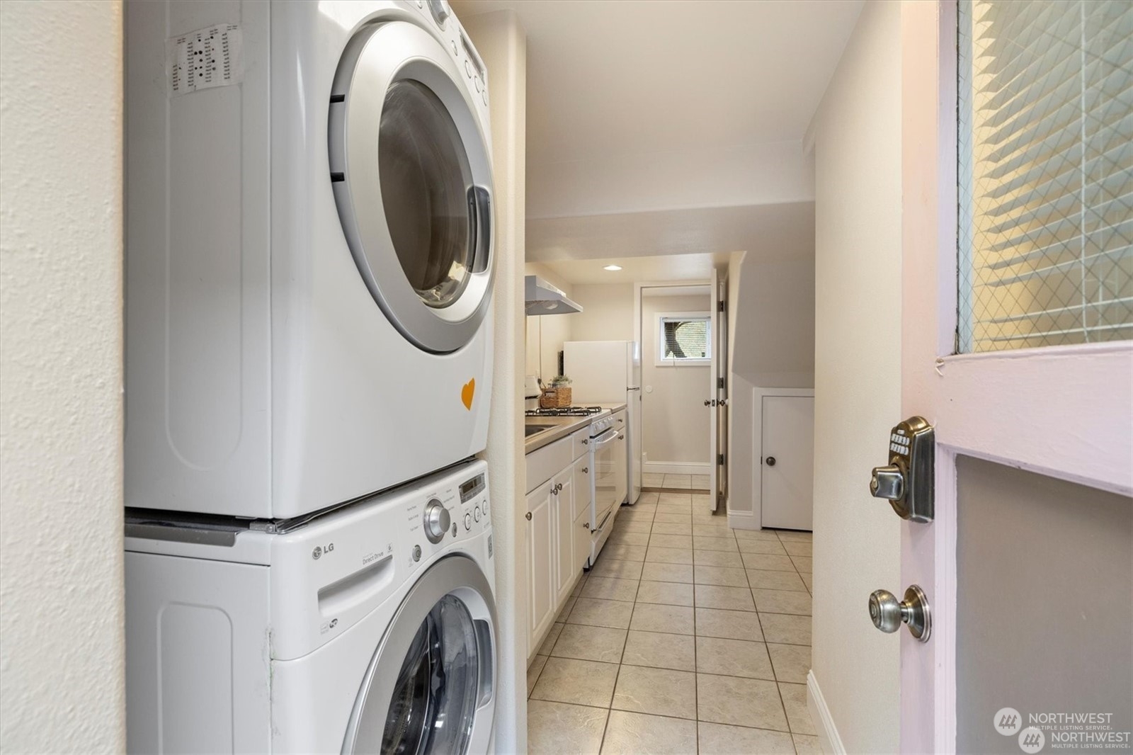 3801 Northeast 75th Street Seattle, WA 98115 - Photo 26 of 40 a view of a storage and utility room with washer and dryer