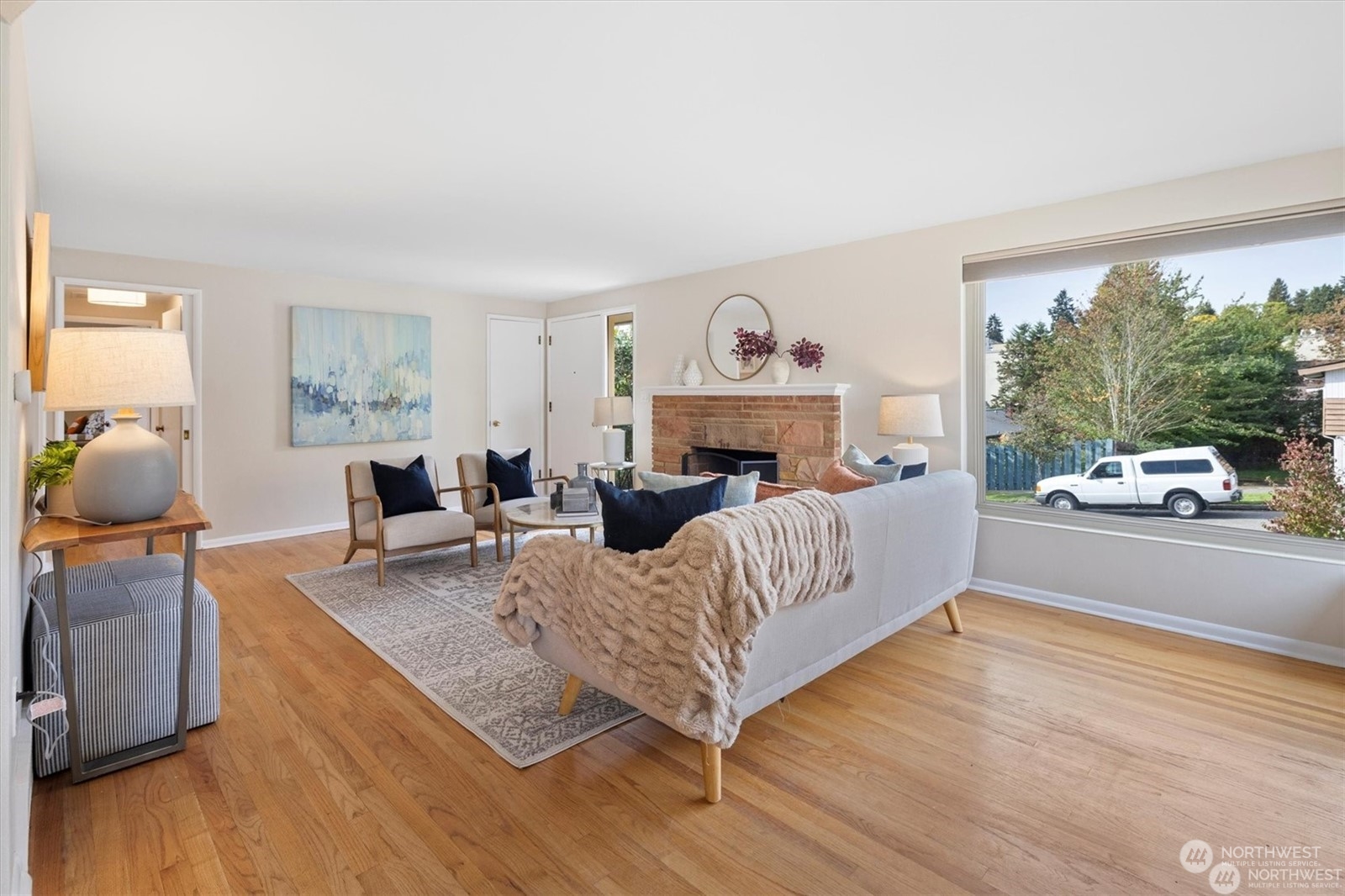 3801 Northeast 75th Street Seattle, WA 98115 - Photo 3 of 40 a living room with furniture and a fireplace