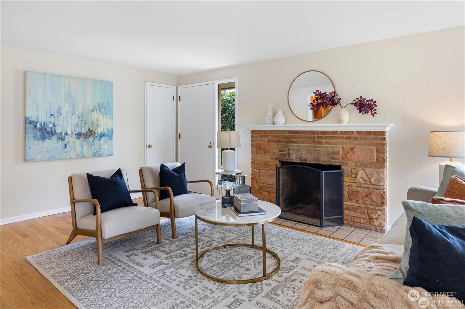 3801 Northeast 75th Street Seattle, WA 98115 - Photo 4 of 40 a living room with furniture a rug and a fireplace