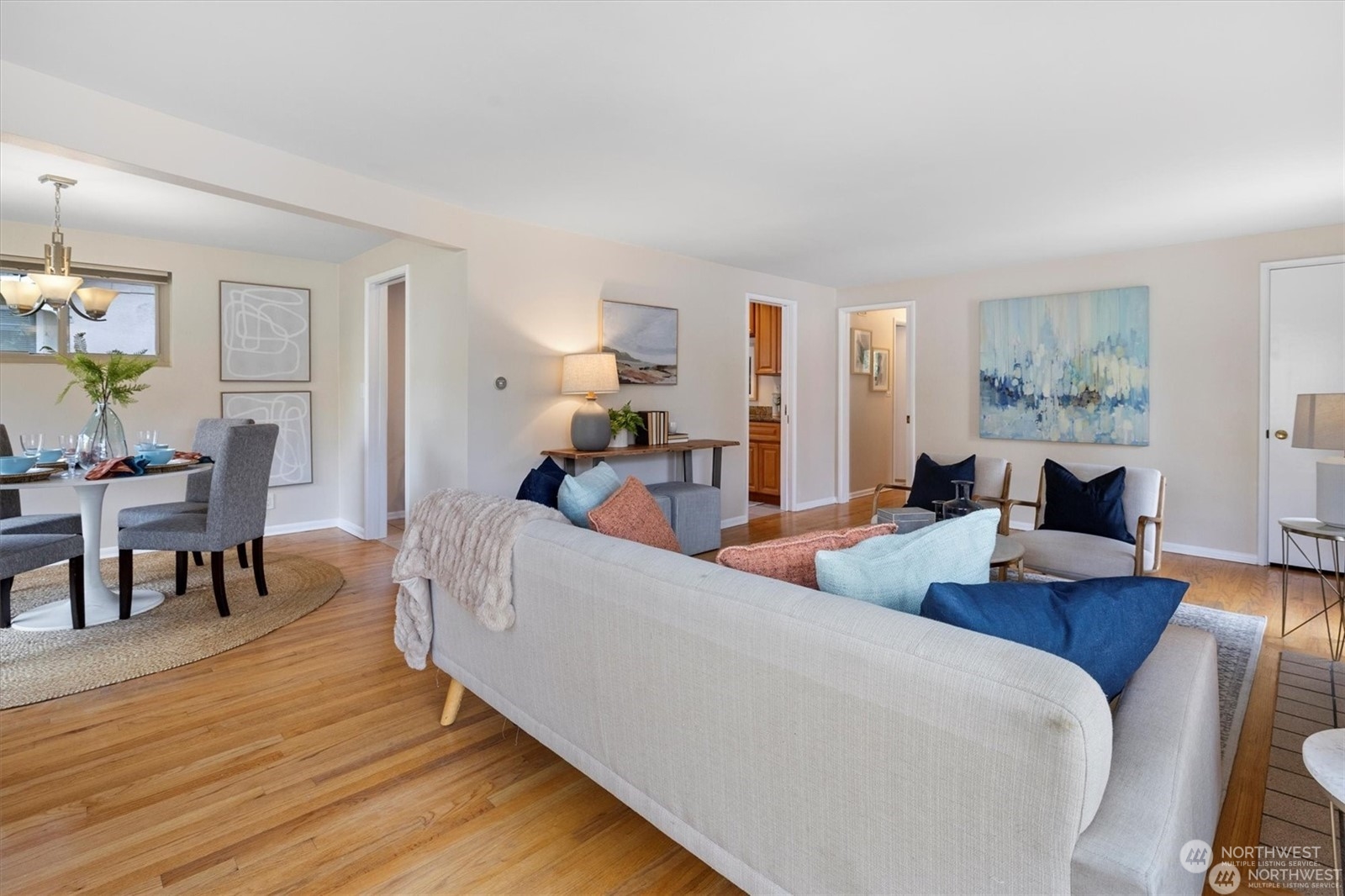 3801 Northeast 75th Street Seattle, WA 98115 - Photo 6 of 40 a living room with furniture and a wooden floor