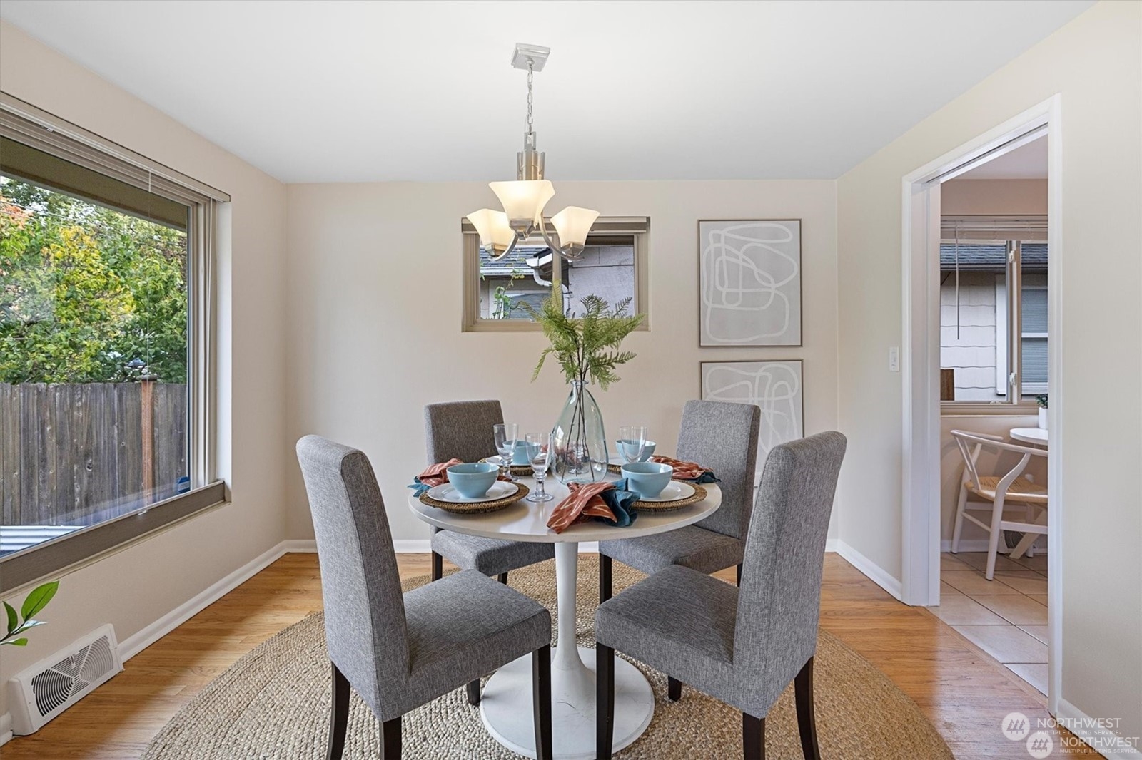 3801 Northeast 75th Street Seattle, WA 98115 - Photo 7 of 40 a dining room filled chandelier and wooden floor