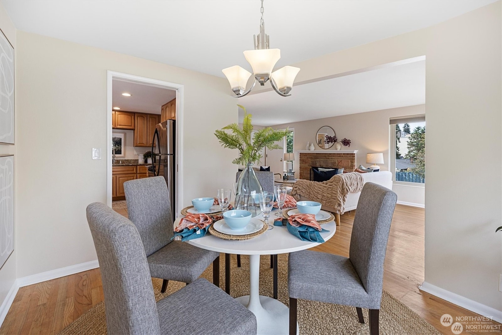 3801 Northeast 75th Street Seattle, WA 98115 - Photo 9 of 40 a view of a dining room with furniture and chandelier