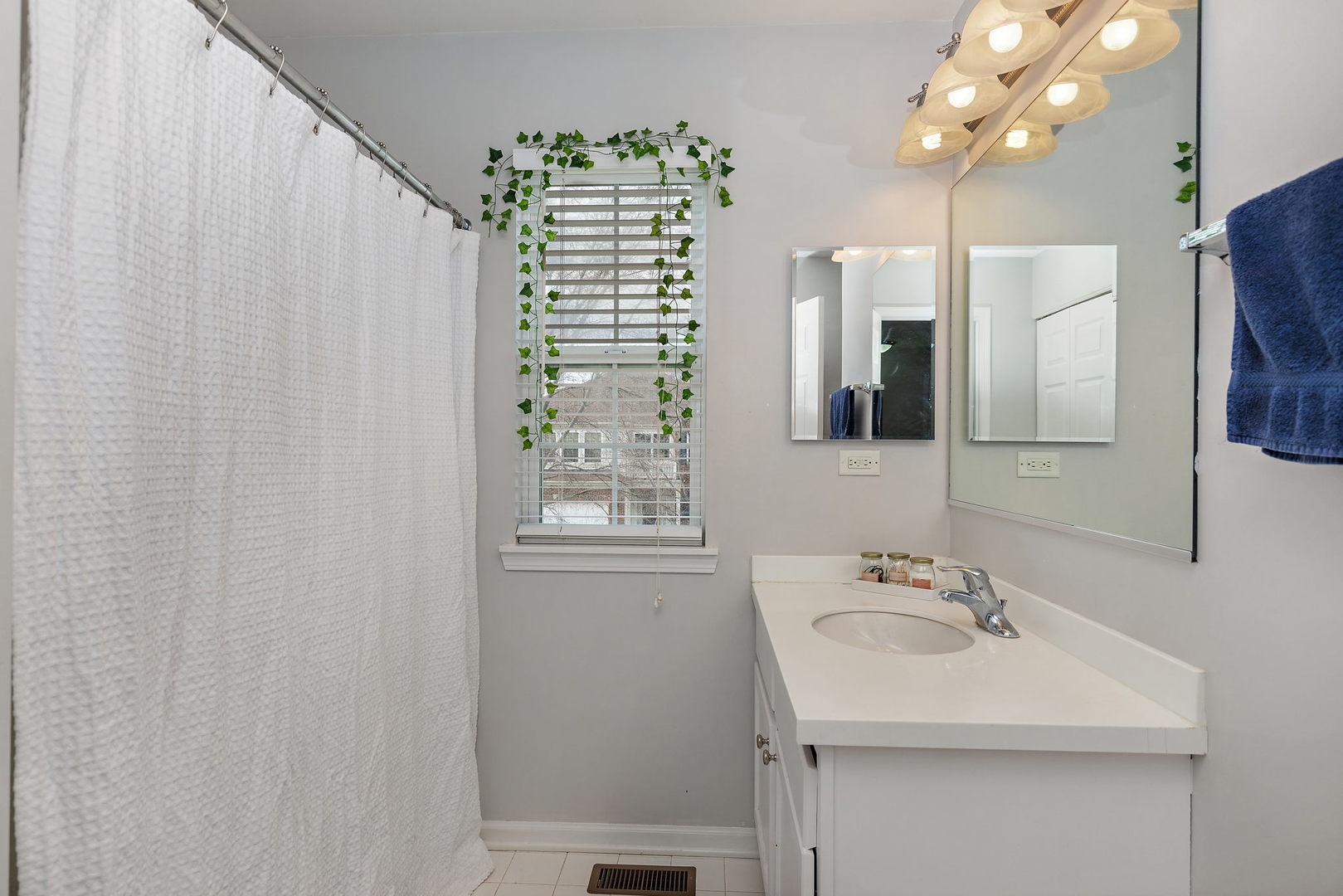 32205 Rockwell Drive McHenry, IL 60051 - Photo 22 of 27 a bathroom with a sink a vanity and a mirror