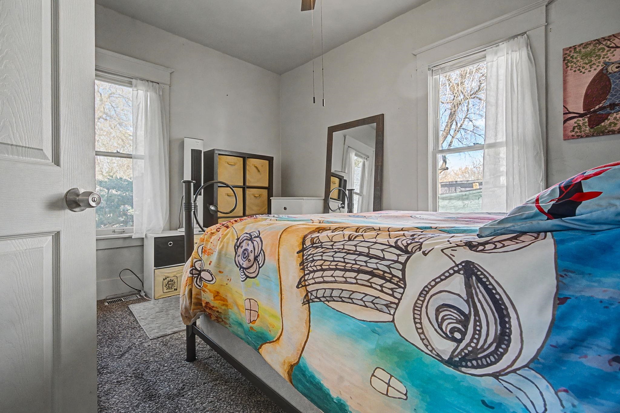 216 4th Street Clifton, CO 81520 - Photo 9 of 17 a bed sitting in a bedroom next to a window