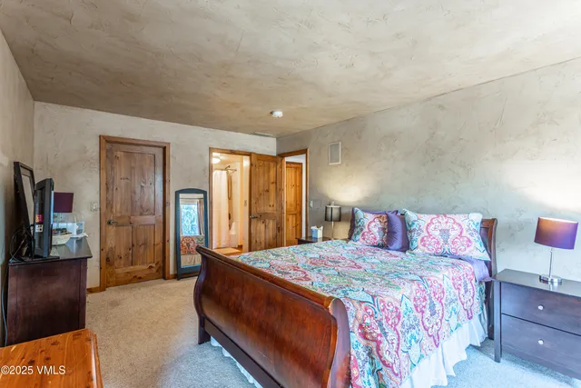 a spacious bathroom with a double vanity sink and a mirror