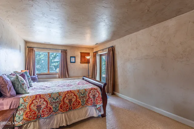a view of balcony with furniture and umbrella