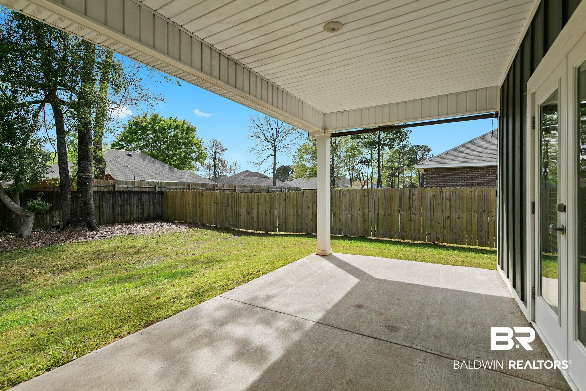 9448 Amethyst Drive Daphne, AL 36526 - Photo 60 of 61 Fenced backyard featuring a patio