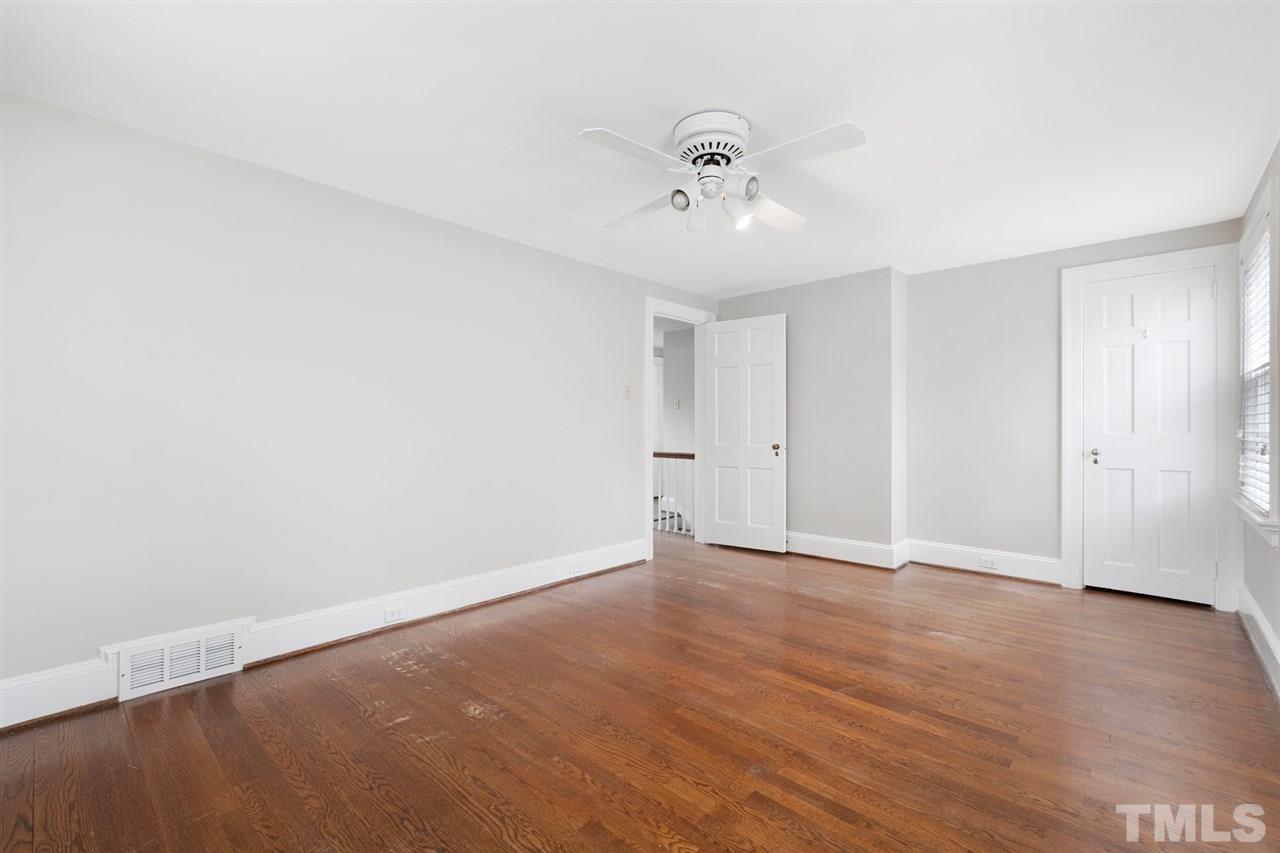 2115 Reaves Drive Raleigh, NC 27608 - Photo 14 of 26 a view of an empty room with wooden floor