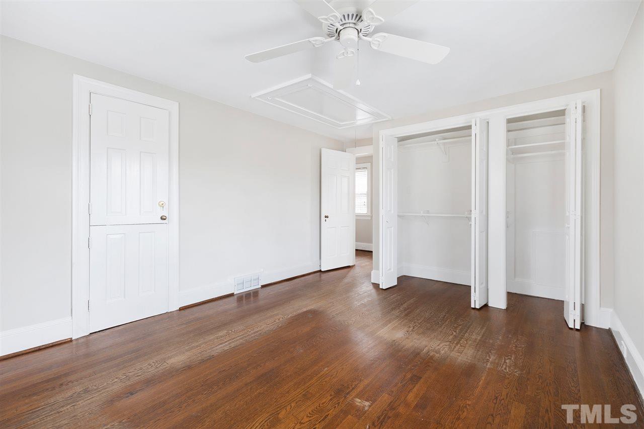 2115 Reaves Drive Raleigh, NC 27608 - Photo 17 of 26 a view of an empty room with wooden floor