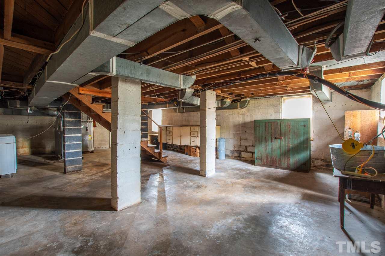 2115 Reaves Drive Raleigh, NC 27608 - Photo 22 of 26 a view of under construction room and staircase