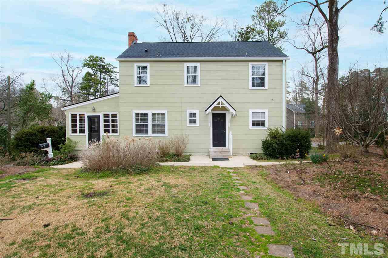 2115 Reaves Drive Raleigh, NC 27608 - Photo 23 of 26 a front view of a house with garden