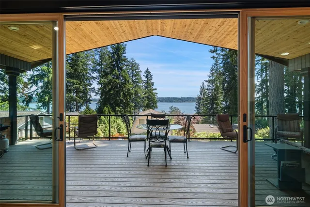 a view of sitting area with furniture and wooden floor