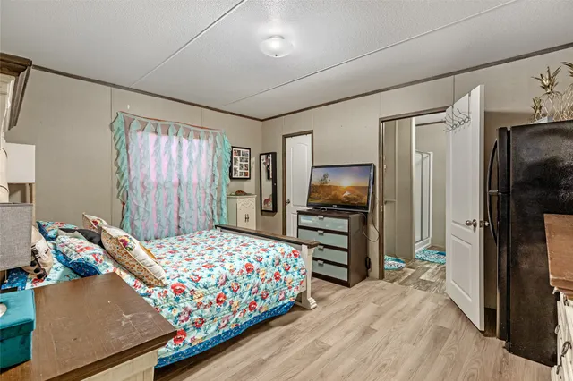 a bedroom with bed and window