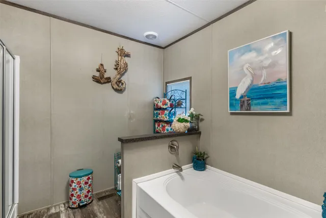 a bathroom with a sink a mirror and a window