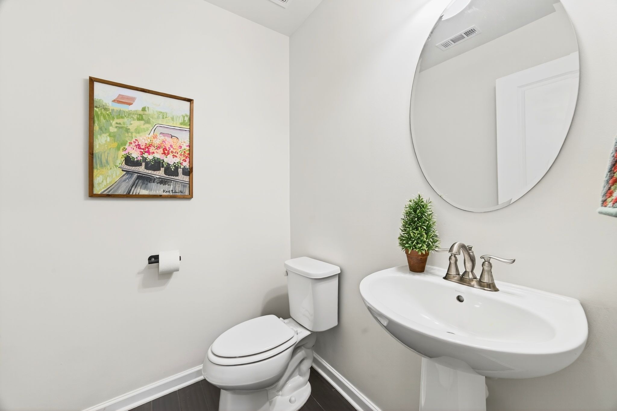 423 Heroit Drive Spring Hill, TN 37174 - Photo 11 of 43 a bathroom with a toilet a sink and a mirror