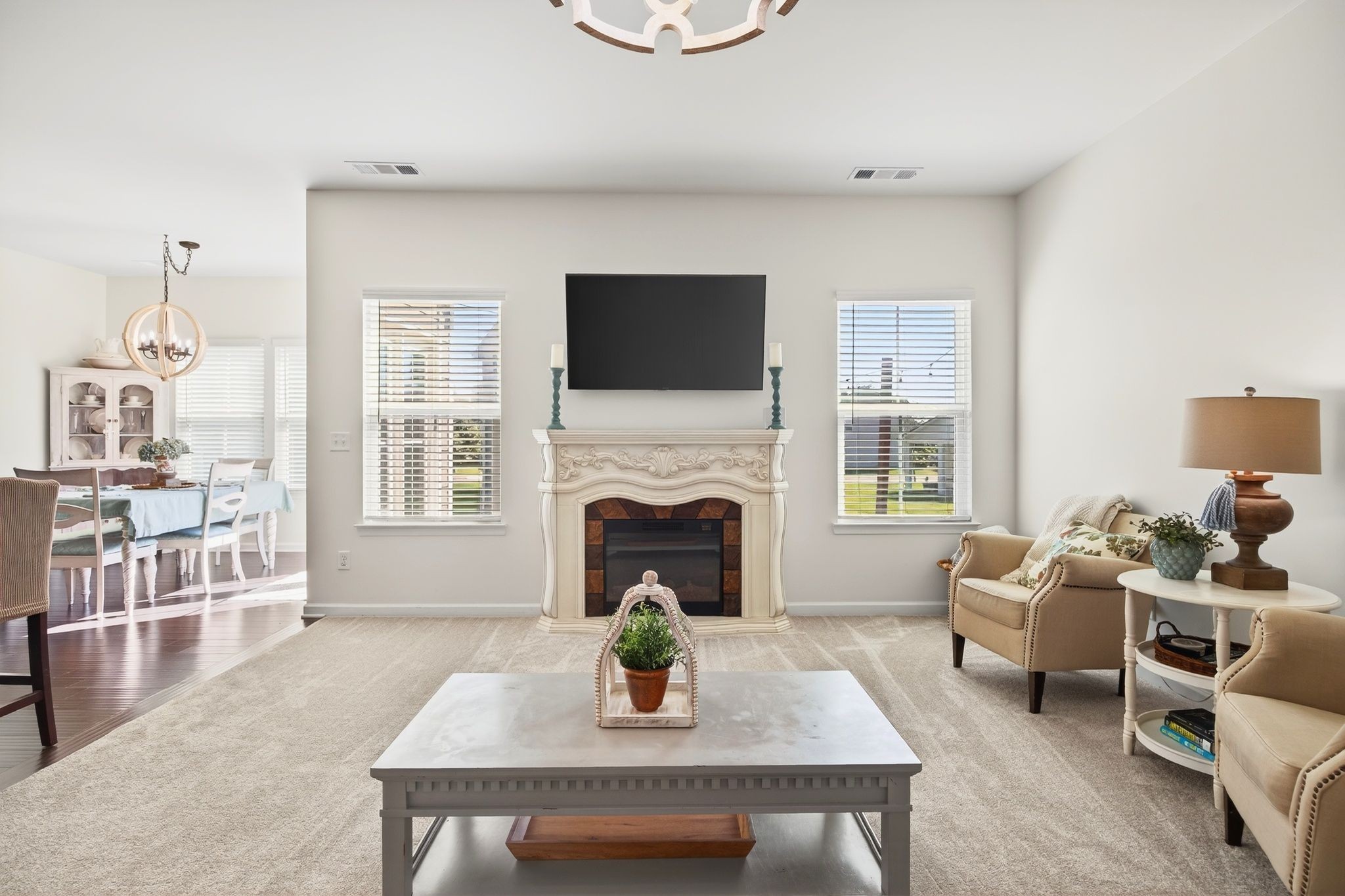423 Heroit Drive Spring Hill, TN 37174 - Photo 12 of 43 a living room with furniture a fireplace and a flat screen tv
