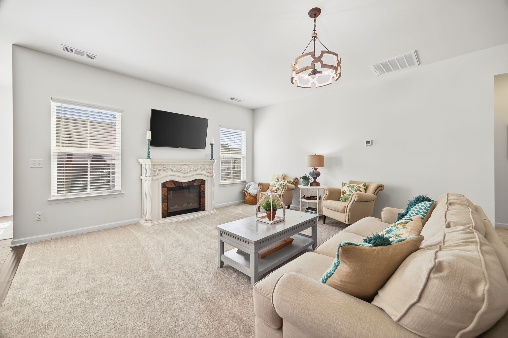 423 Heroit Drive Spring Hill, TN 37174 - Photo 14 of 43 a living room with furniture a fireplace and a flat screen tv