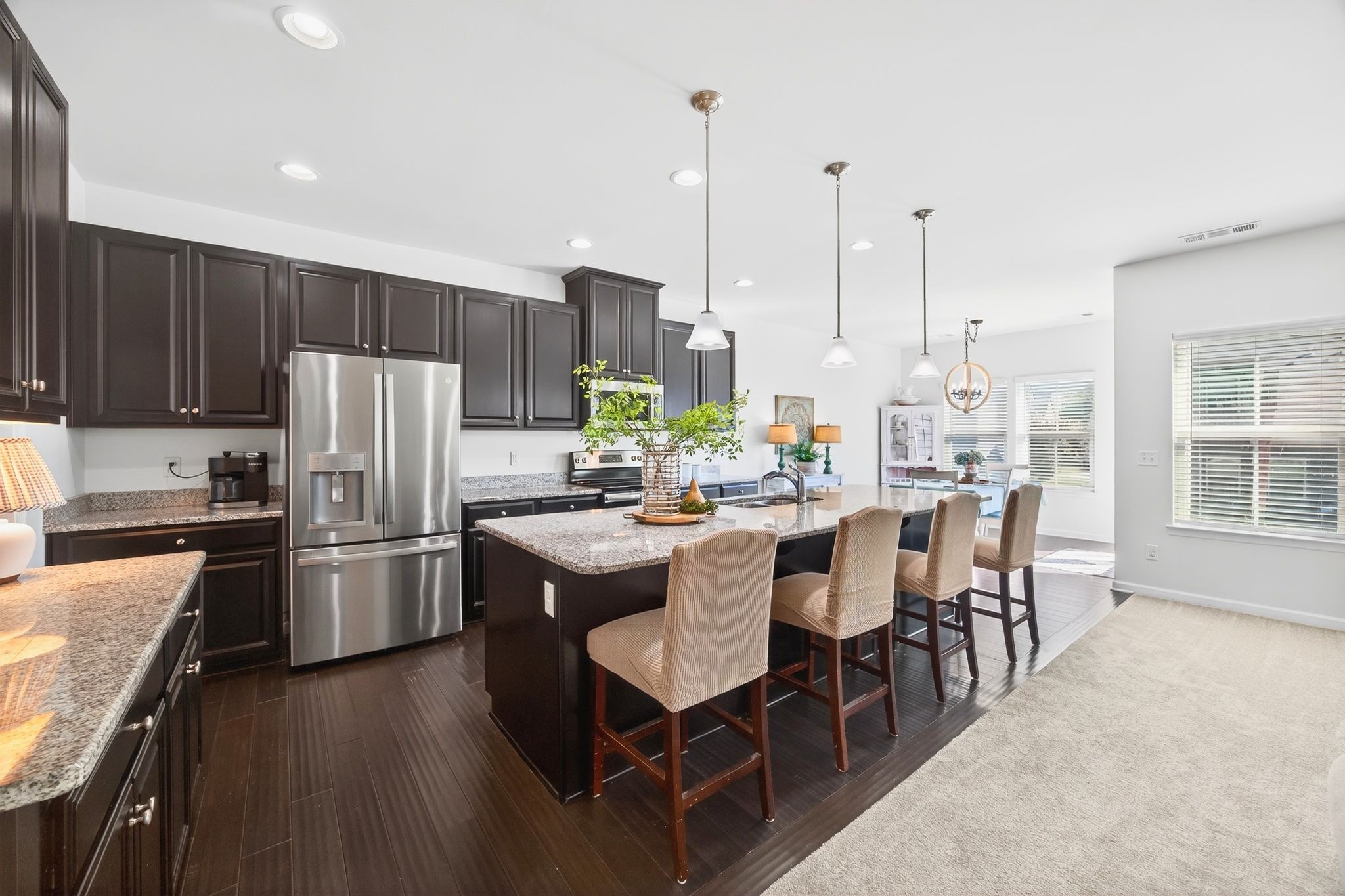 423 Heroit Drive Spring Hill, TN 37174 - Photo 19 of 43 a kitchen with kitchen island a large counter top space appliances and cabinets