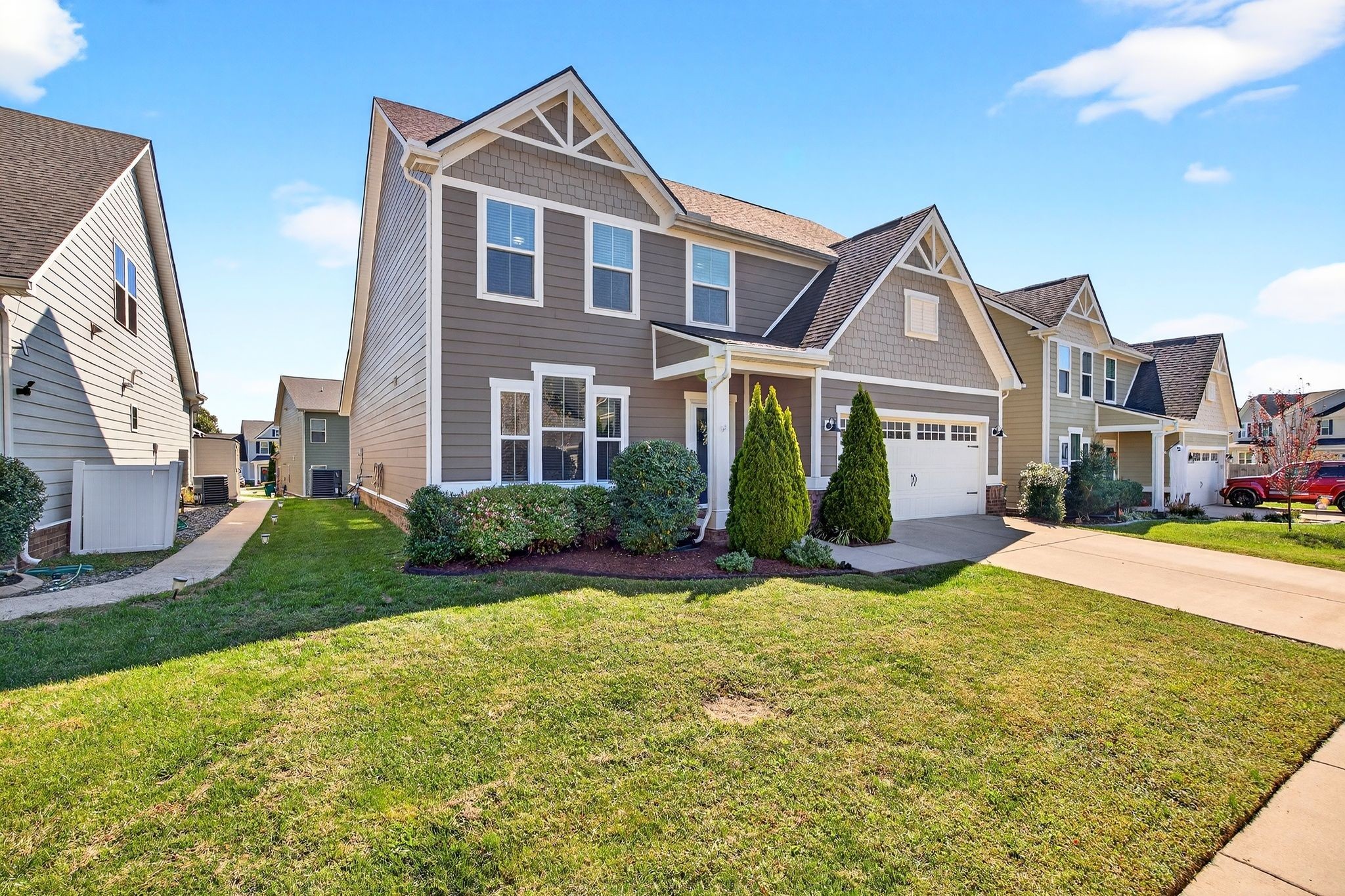 423 Heroit Drive Spring Hill, TN 37174 - Photo 3 of 43 a front view of a house with a yard and garage