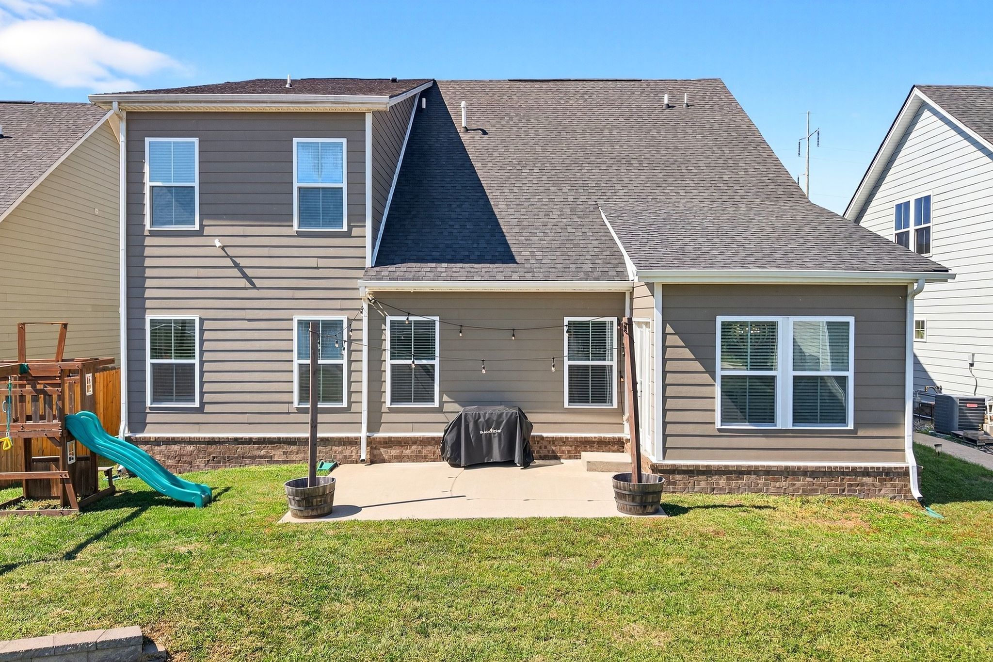 423 Heroit Drive Spring Hill, TN 37174 - Photo 40 of 43 a view of a house with a yard and a floor to ceiling window
