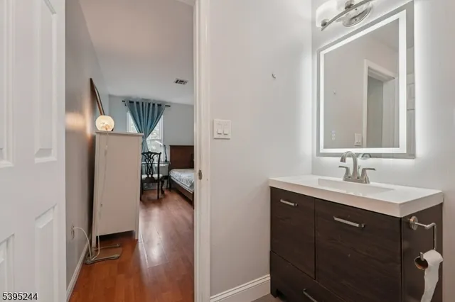 a en suite bathroom with a sink and mirror
