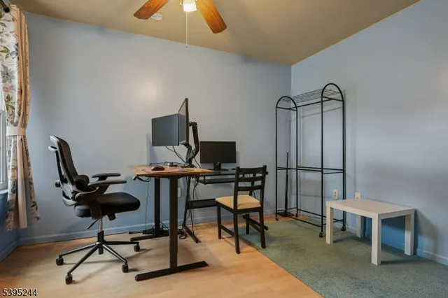 a view of a workspace with furniture