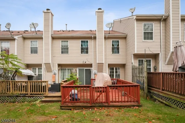 a view of a house with swimming pool and porch