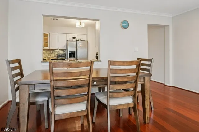 a view of kitchen with furniture and wooden floor