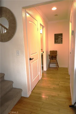 a view of a livingroom with wooden floor and chair