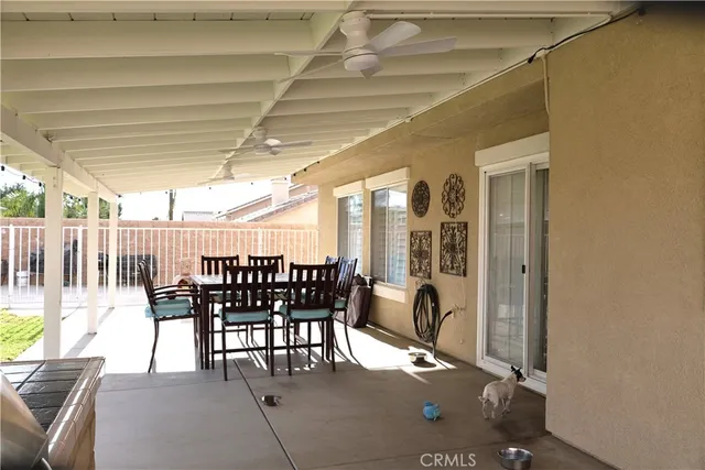 a view of a kitchen with a table and chairs