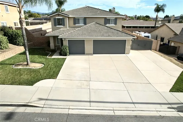 a view of a house with backyard porch and sitting area