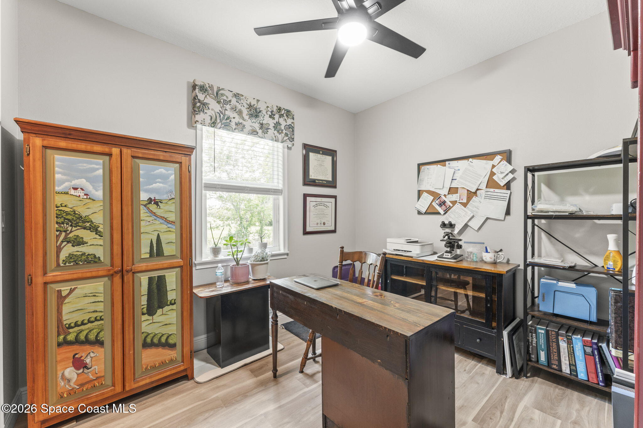 1740 Ford Road Mims, FL 32754 - Photo 28 of 43 a view of a workspace with furniture and a window
