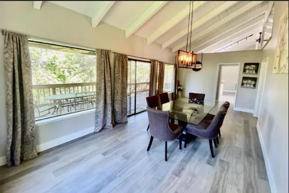 a dining room with furniture window wooden floor