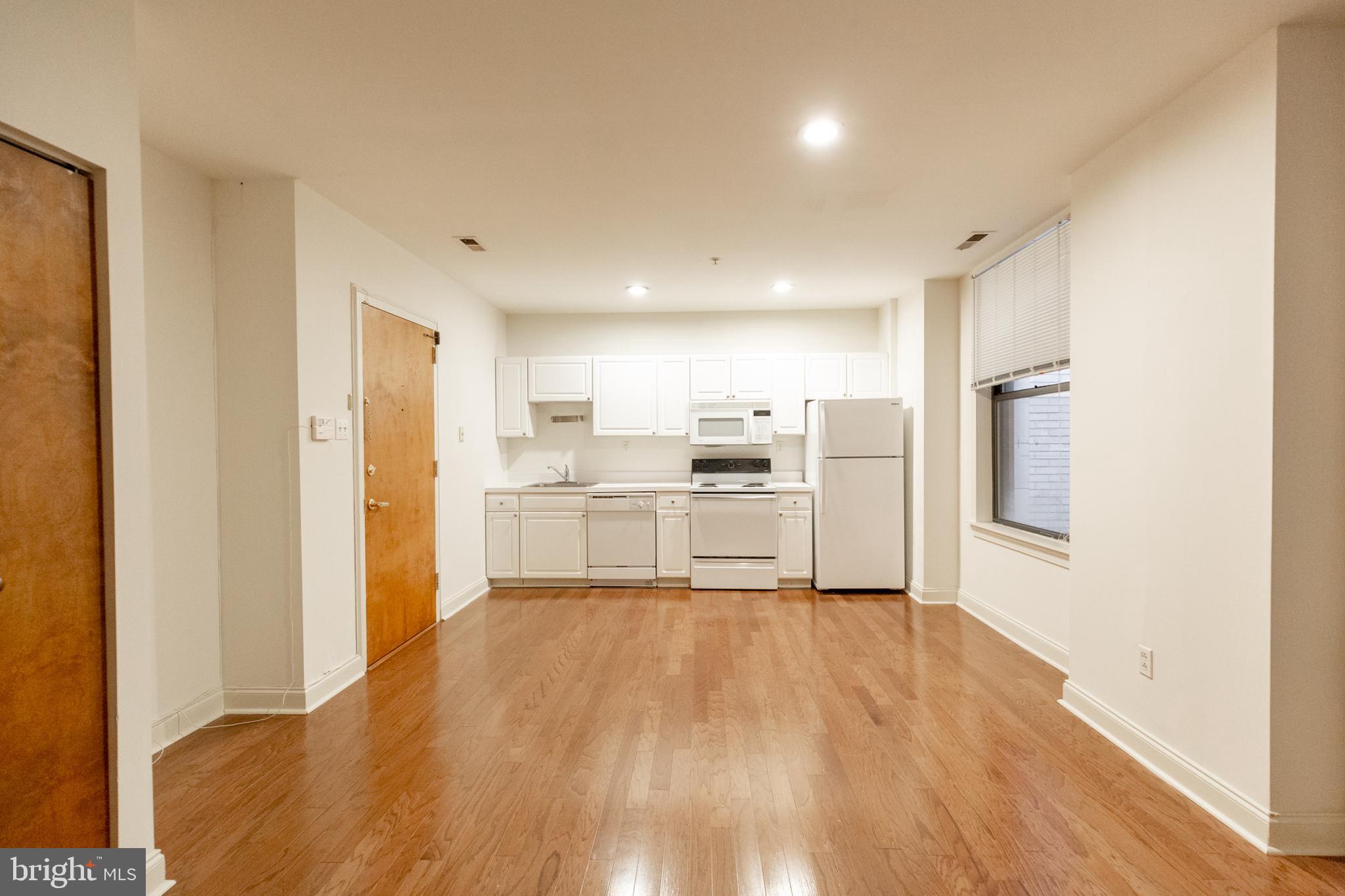 1411-5 Walnut Street, Unit 906 Philadelphia, PA 19102 - Photo 7 of 20 a view of kitchen with wooden floor