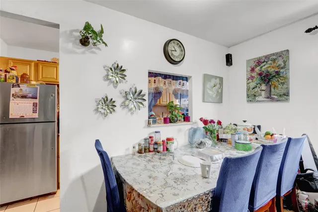 a kitchen with stainless steel appliances granite countertop a stove and a refrigerator
