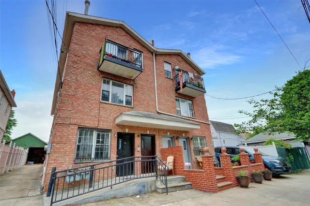 a view of a pathway with a house in the background
