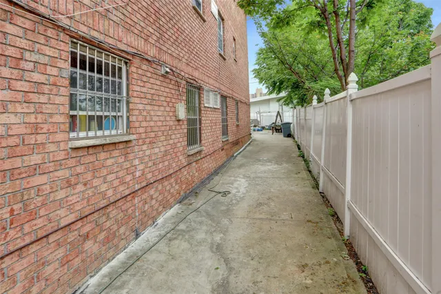 a view of a patio with table and chairs and potted plants