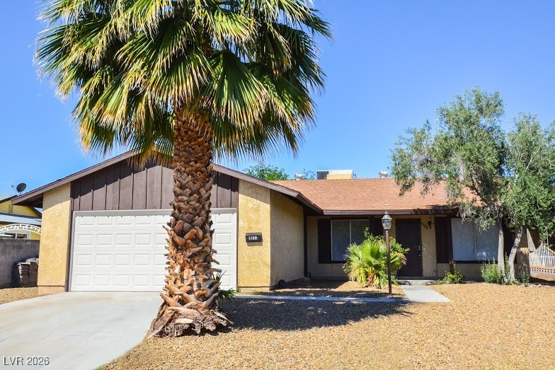 1108 Meadbrook Street Las Vegas, NV 89110 - Photo 1 of 41 View of front facade featuring an attached garage, driveway, and stucco siding