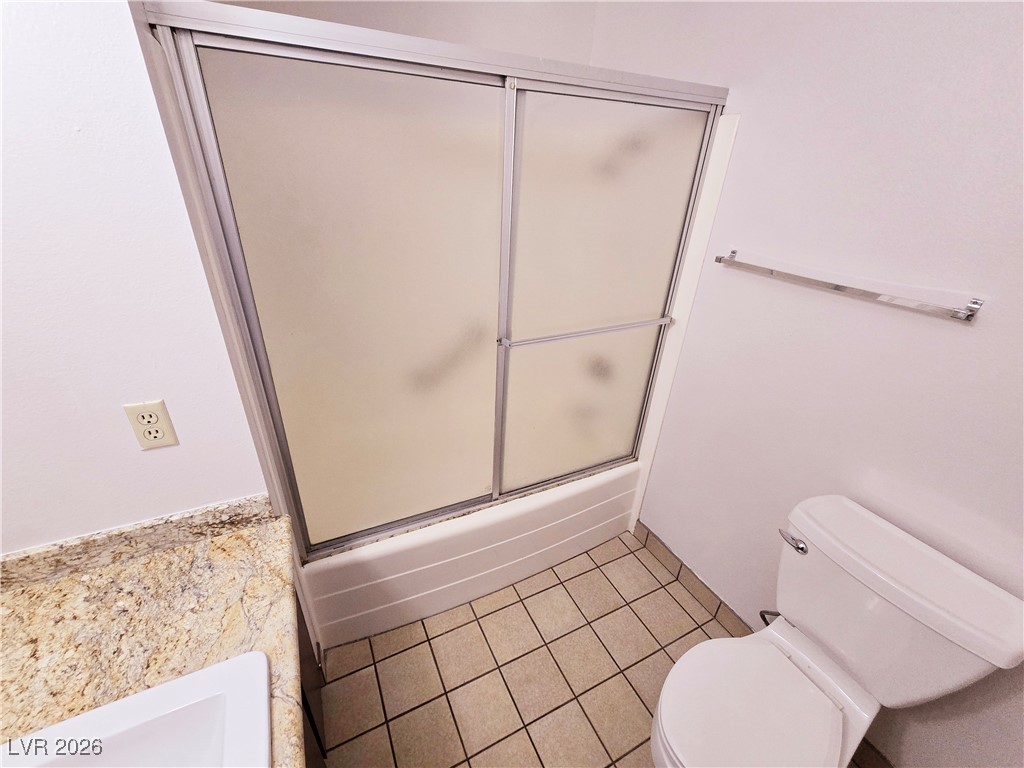 1108 Meadbrook Street Las Vegas, NV 89110 - Photo 23 of 41 Full bath with combined bath / shower with glass door and light tile patterned floors