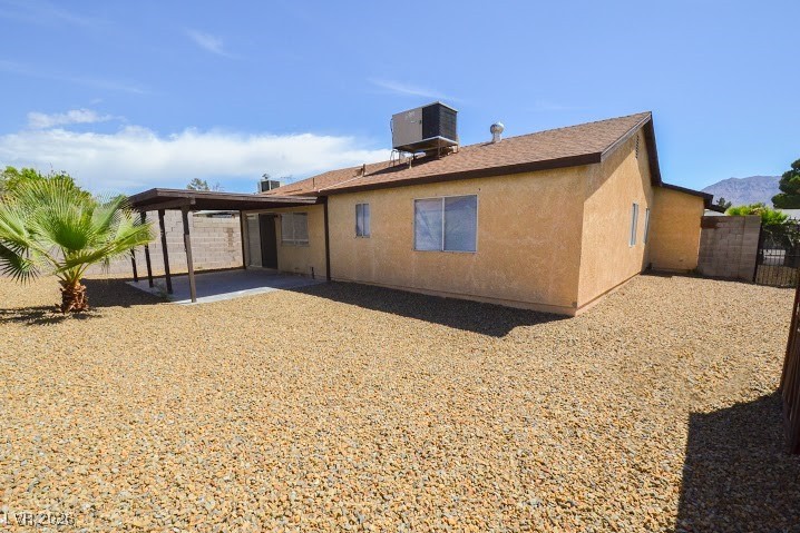 1108 Meadbrook Street Las Vegas, NV 89110 - Photo 38 of 41 Back of property featuring a patio area, stucco siding, and a fenced backyard